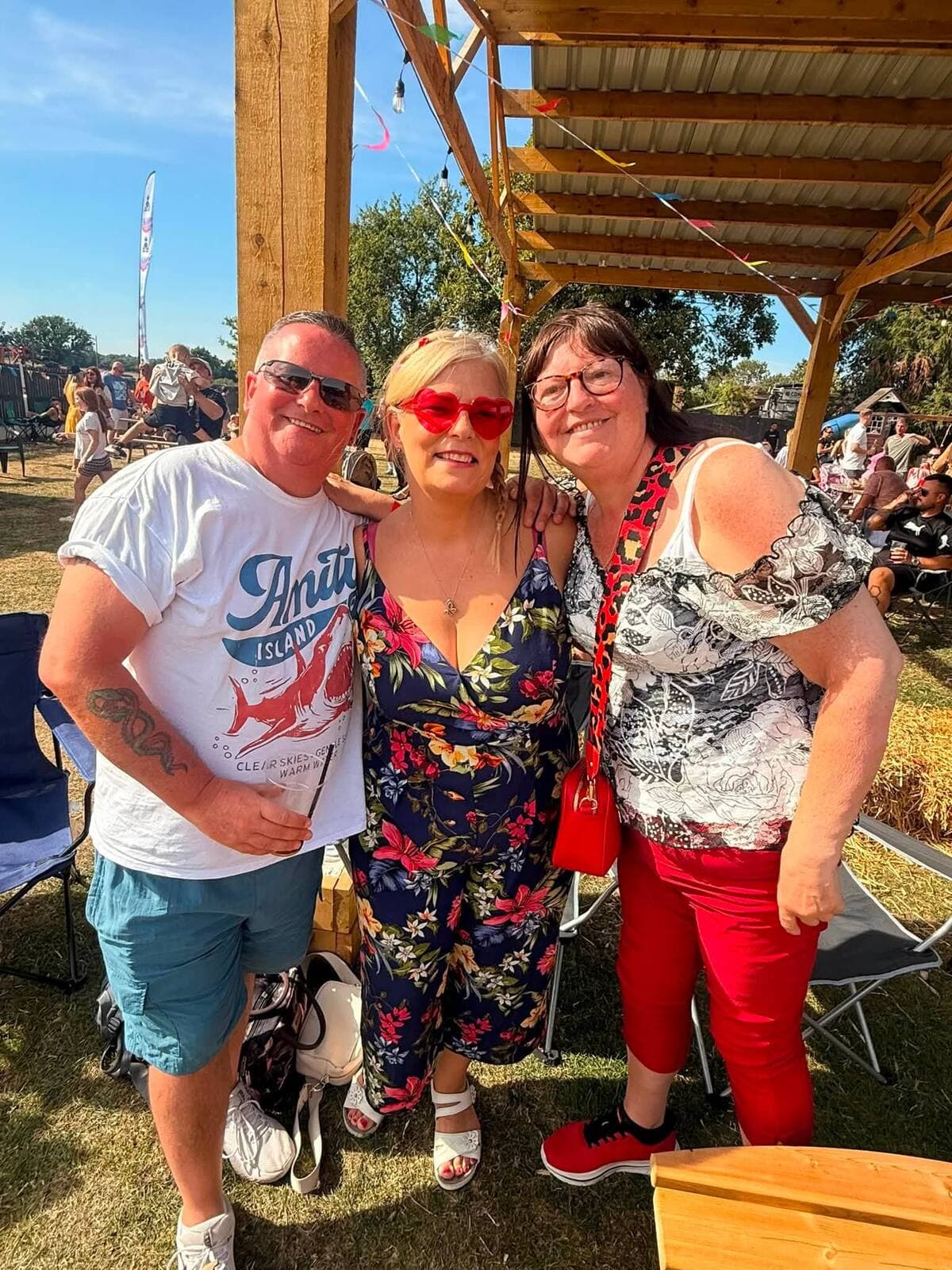 Three friends together under the pergola at the WN7 FEST Garden Party